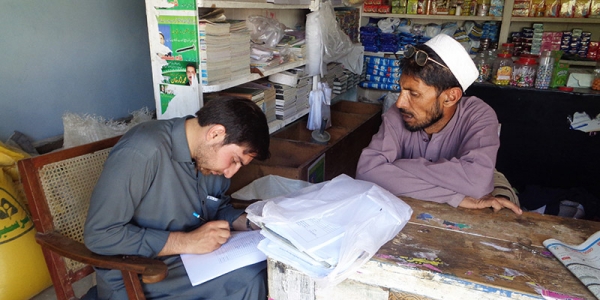 Baseline household survey, June 2015 — a surveyor is completing the questionnaire, Upper Dir